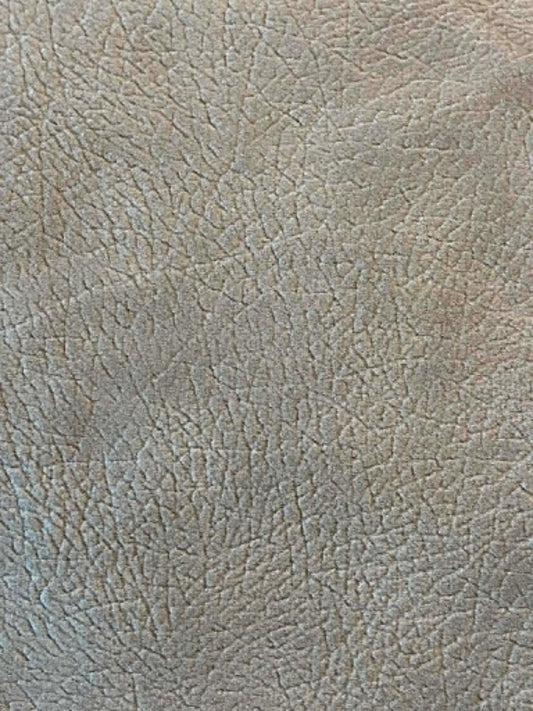 Tan faux suede.  54" wide.  Sold by the half yard.