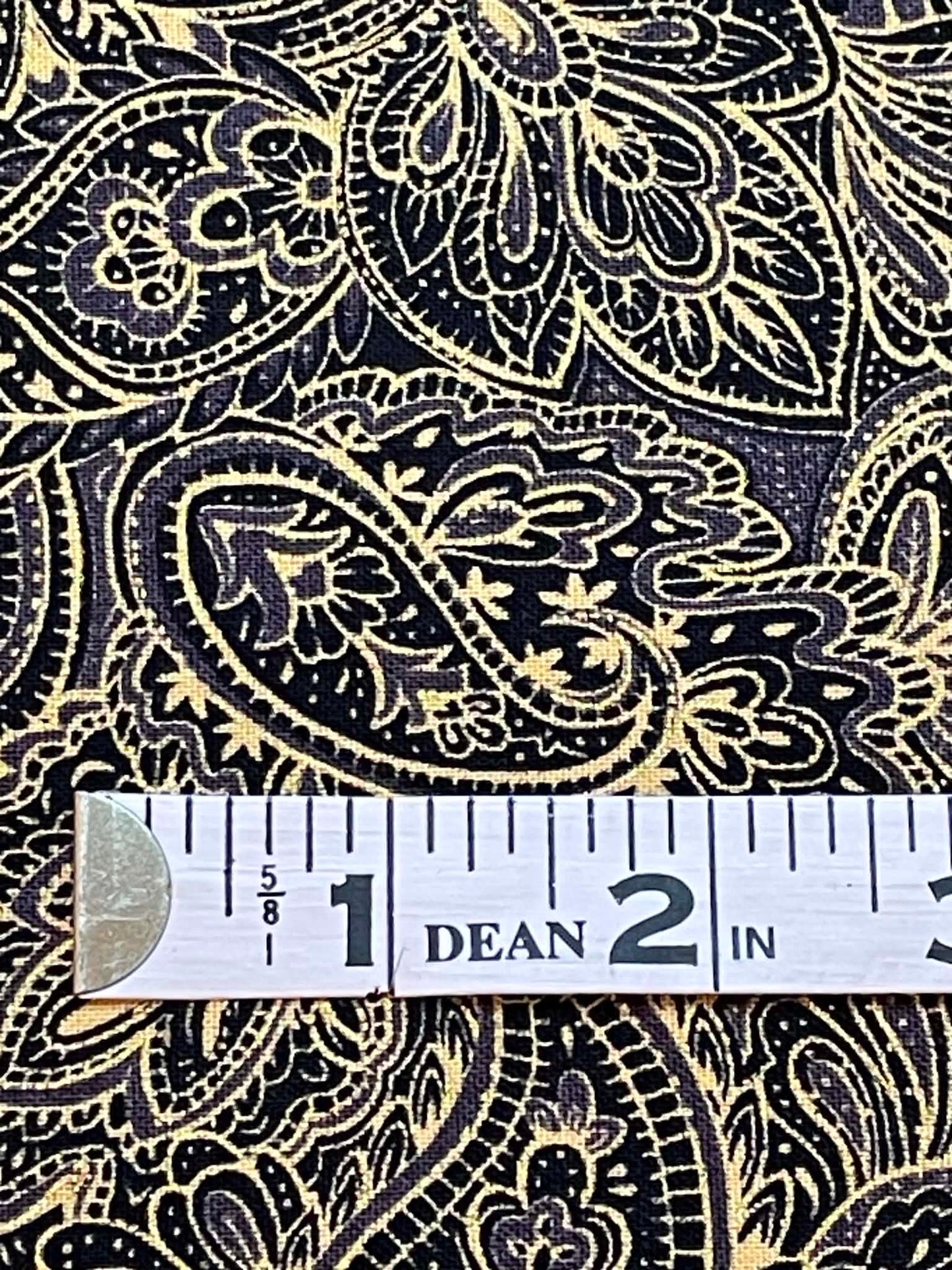 Studio 8, black and yellow paisley.  Sold by the yard.