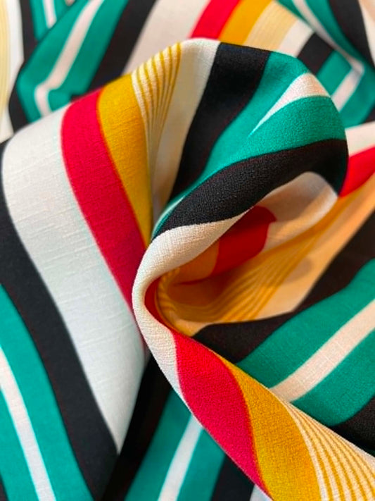 Green, red, yellow, black and white stripes.  Polyester crepe.  ** REMNANT **