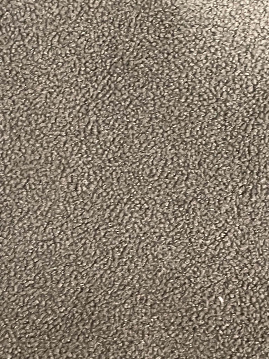 Dark green fuzzy upholstery fabric.  Sold by the yard.