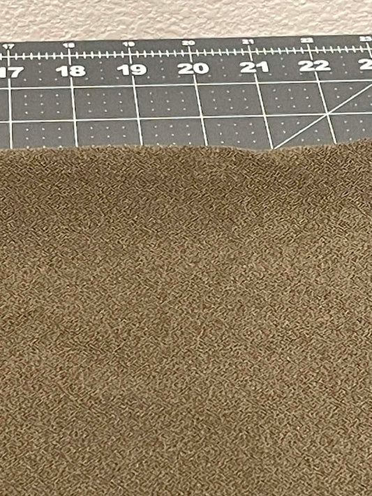 Greenish colored heavy apparel crepe fabric.  Sold by the yard.