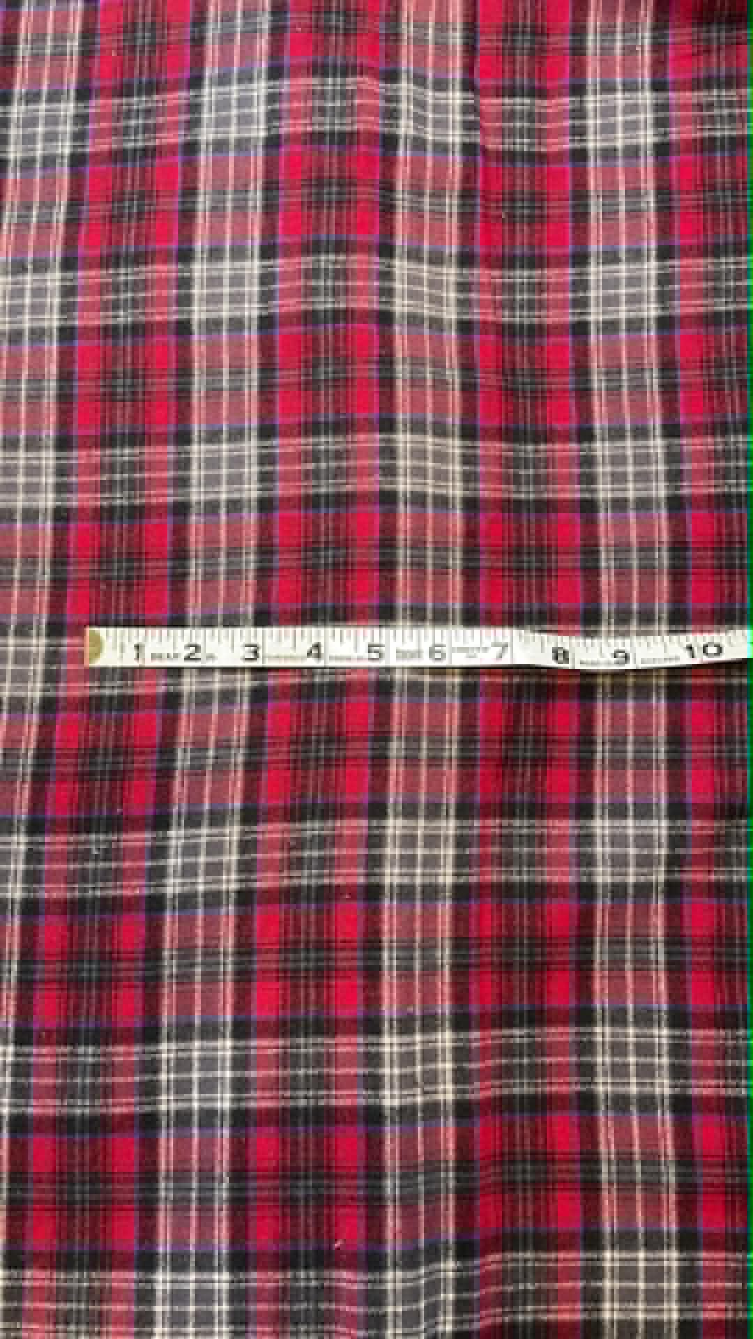 Ozark Mountain flannel.  Dark red with black and white and small blue line.  Sold by the yard.