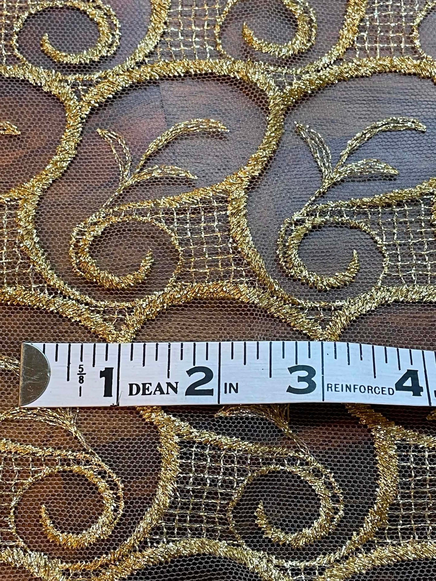 Metallic Gold All Over Lace.  Scalloped on both edges.  Sold by the yard.