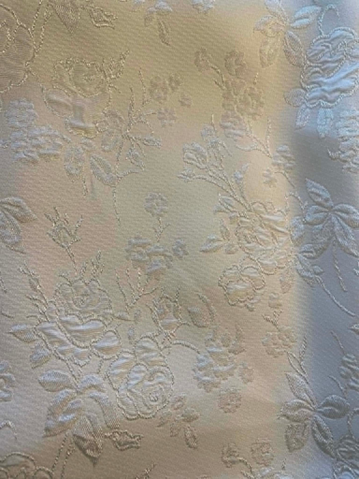 Cream colored satin jacquard.  Sold by the yard.