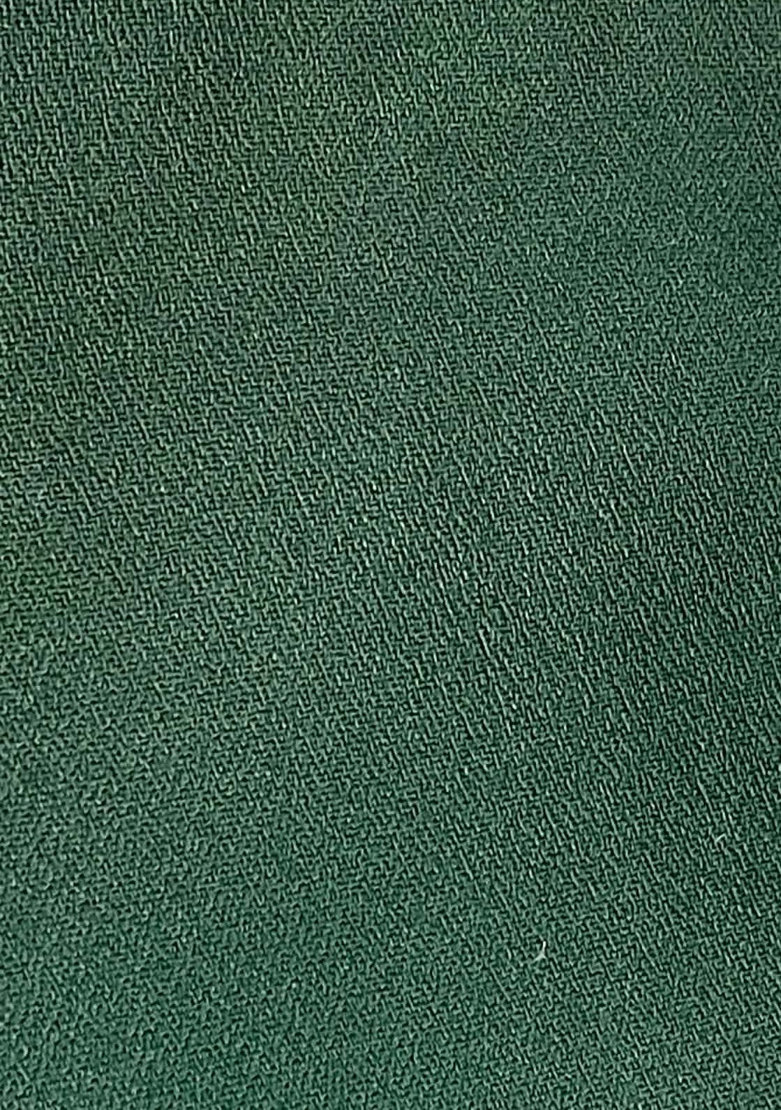 Dark green heavy weight crepe fabric.  Sold by the yard.