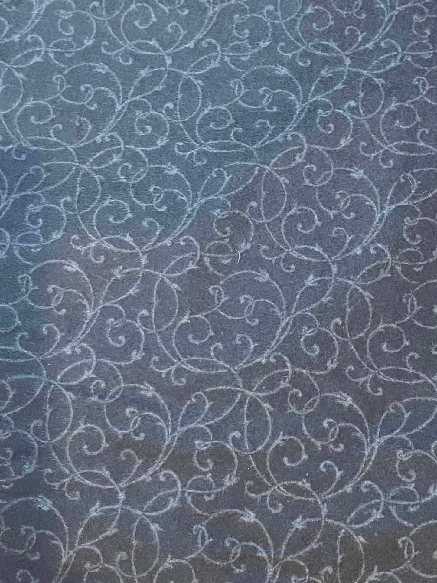 Flannel.  "Carousel" Black with gray swirls.  Sold by the half yard.