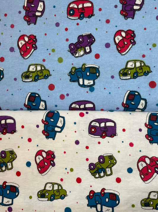Flannel cartoon cars and polka dots.  Sold by the yard.