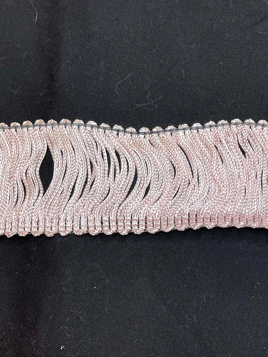 2" wide pink rayon chainette trim.  Sold by the half yard.