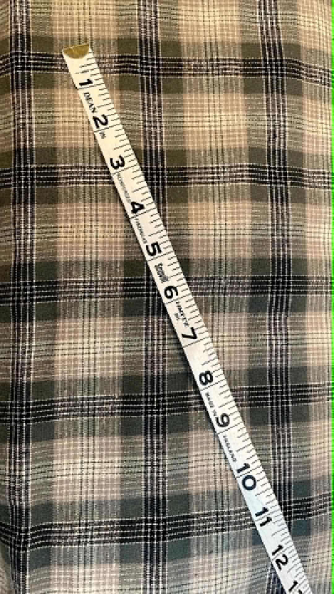 Ozark Mountain flannel.  Green, tan and black plaid.  Sold by the yard.