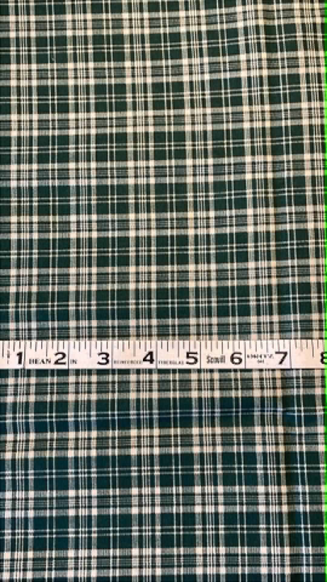 Hunter green and white plaid print.  Sold by the half yard.