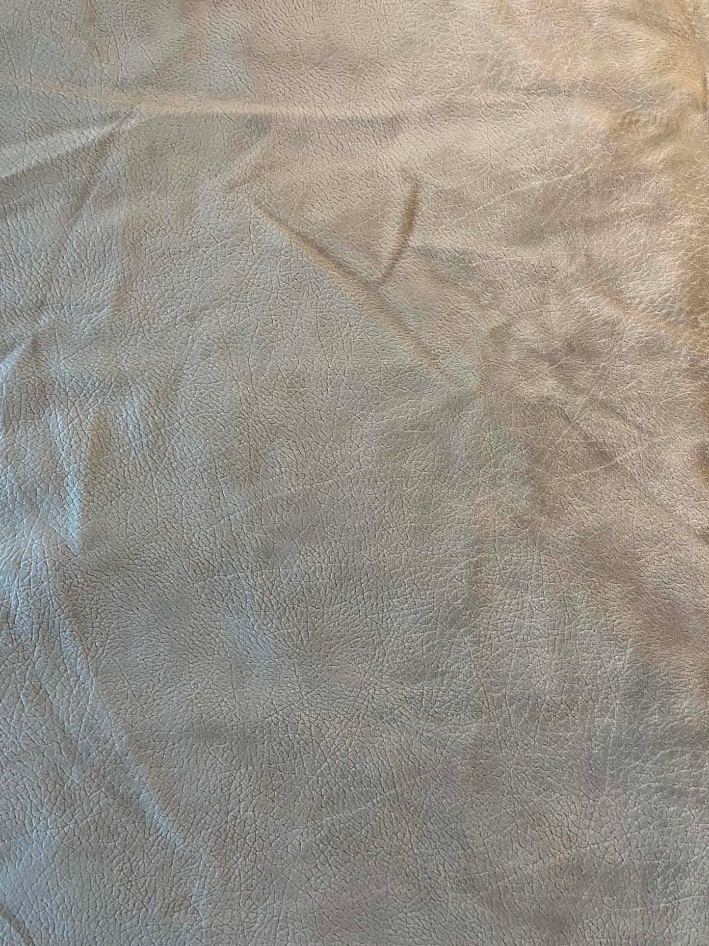 Tan faux suede.  54" wide.  Sold by the half yard.