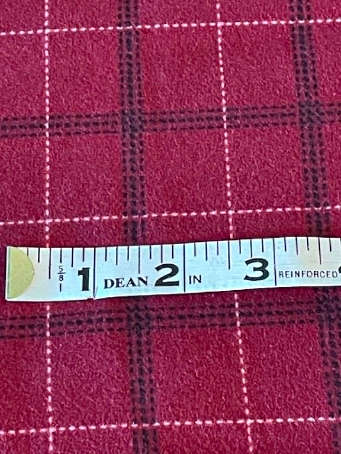 Flannel.  Red with black and white.  Sold by the yard