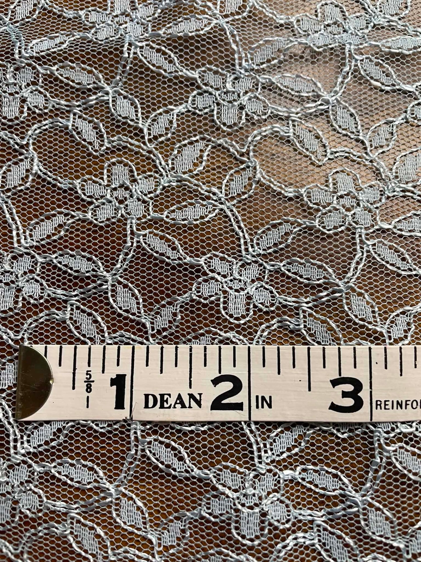 Baby blue floral all over lace.   Sold by the yard.