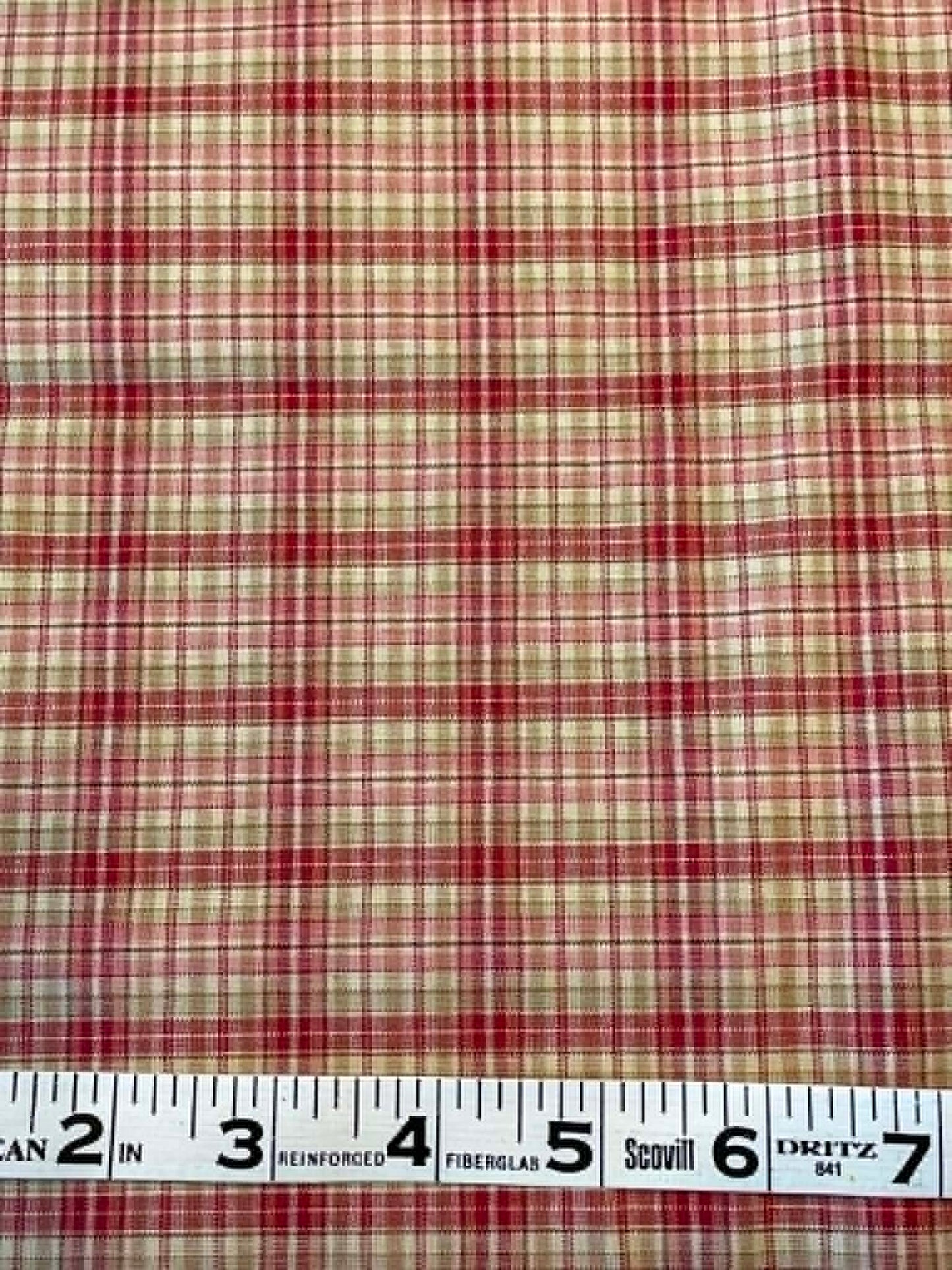 Red and tan plaid shirting.  Sold by the half yard.