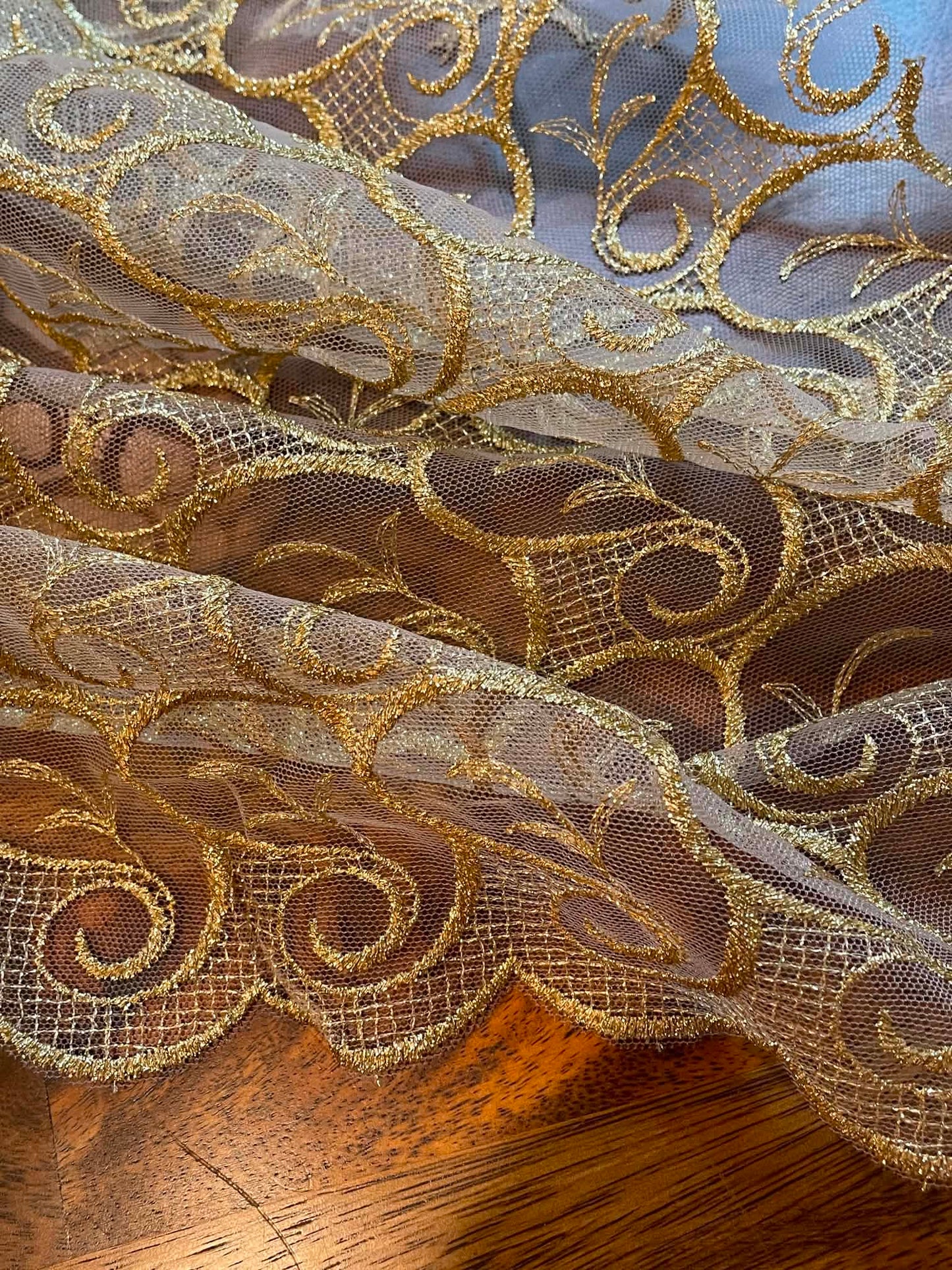 Metallic Gold All Over Lace.  Scalloped on both edges.  Sold by the yard.