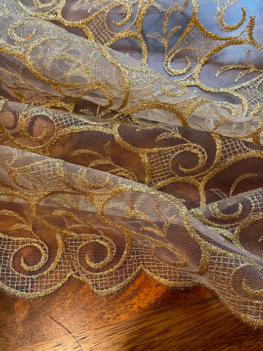 Metallic Gold All Over Lace.  Scalloped on both edges.  Sold by the yard.