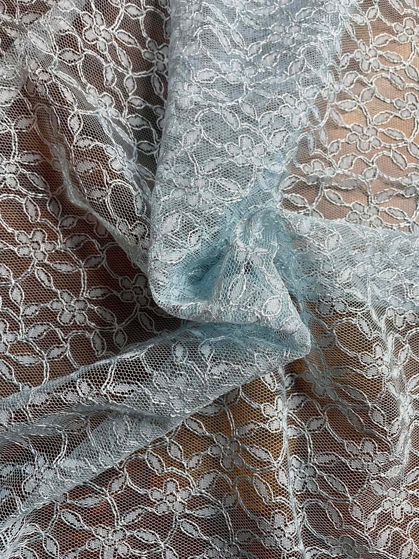 Baby blue floral all over lace.   Sold by the yard.