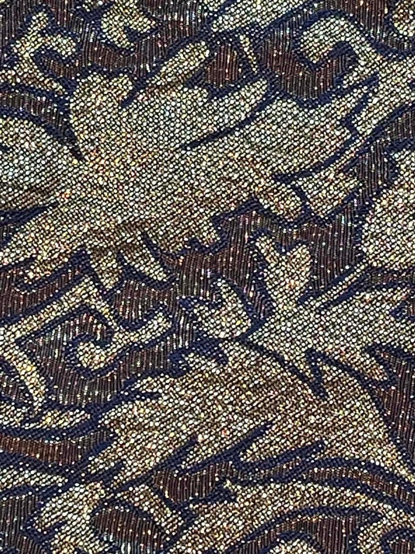 Black and metallic gold brocade.  Sold by the yard.
