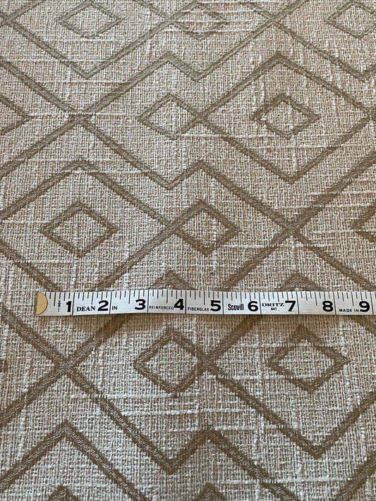 Two toned tan diamond geometric pattern upholstery fabric.  Sold by the yard.