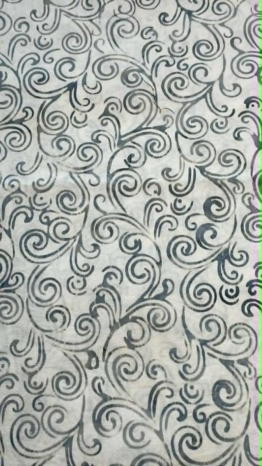 Bluish gray swirls on white background.  Sold by the half yard.