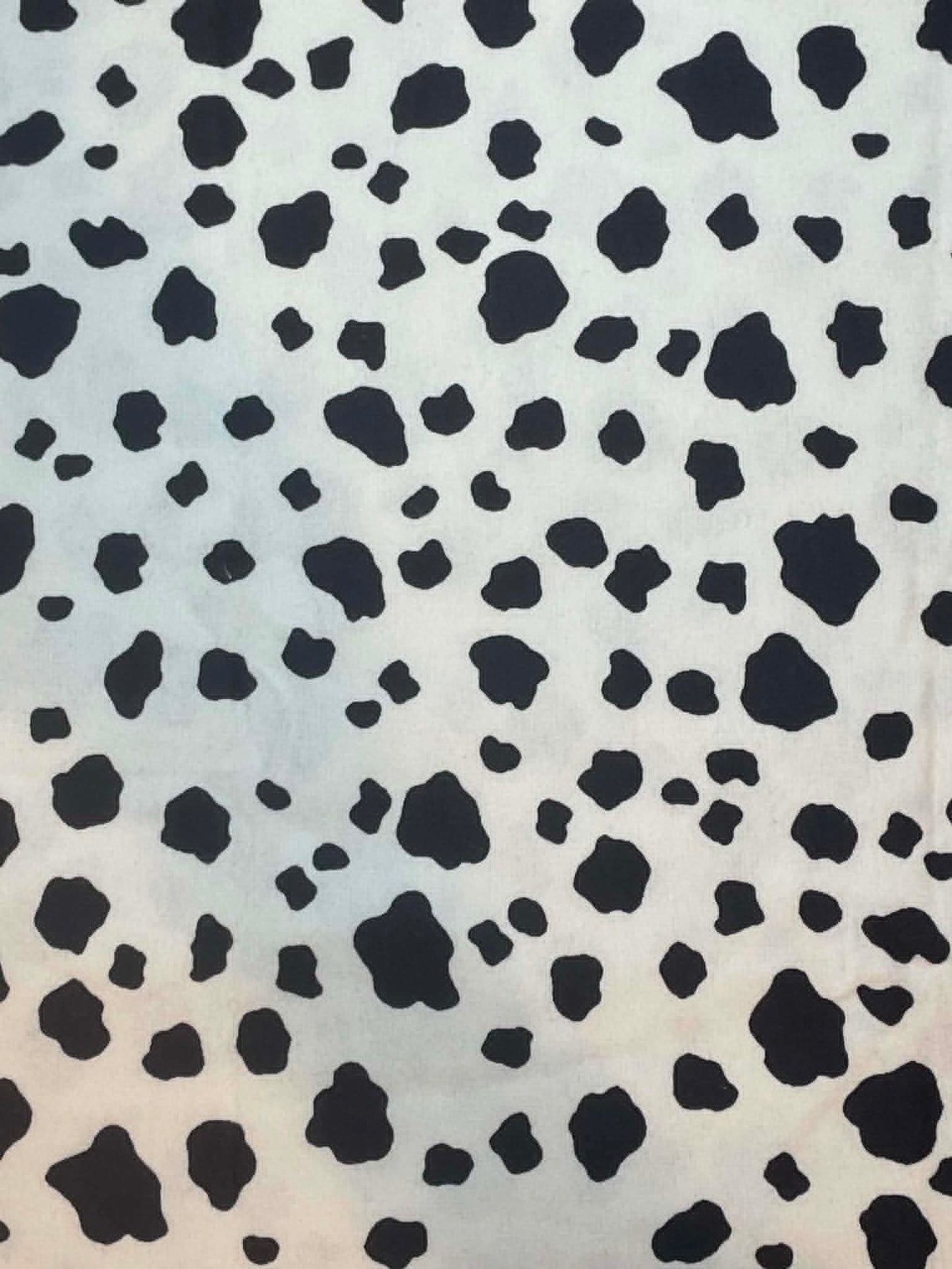 Flannel.  Black and white cow hide print.  Sold by the half yard.