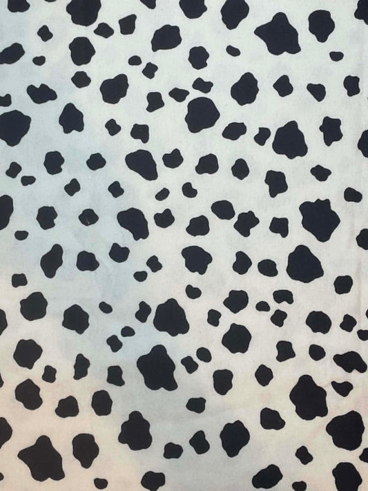 Flannel.  Black and white cow hide print.  Sold by the half yard.