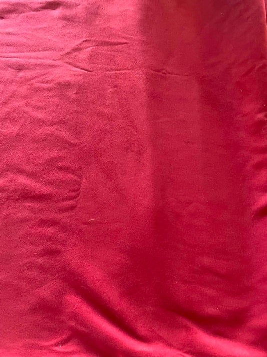 Burgundy color faux suede.  Sold by the yard.