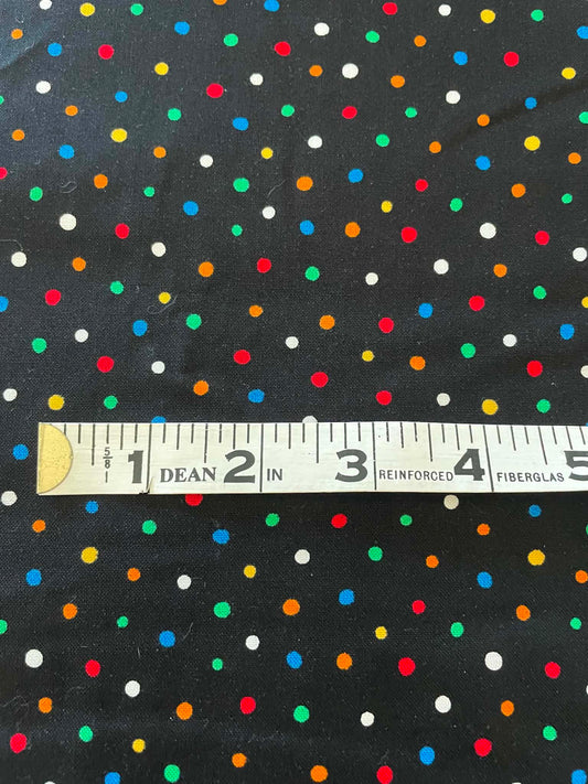 Dot Frolic.  Multi colored dots on black background.  Sold by the yard.