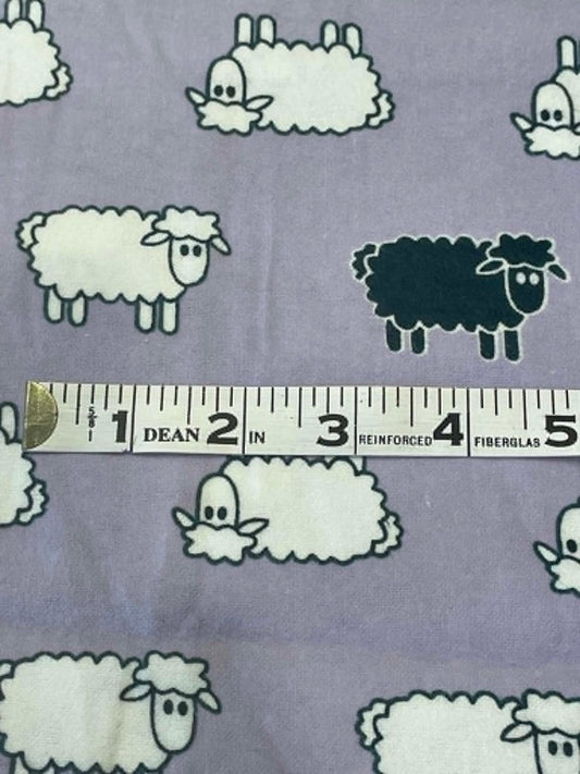 Flannel.  Sheep on lavender background.  Sold by the half yard.