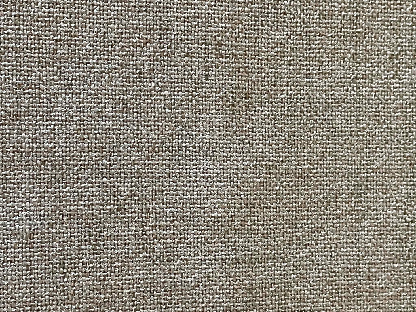 Grayish, off white upholstery fabric with white felt backing.  Sold by the half yard.