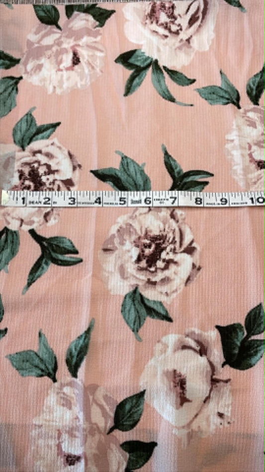 Light colored roses on light pink background.  Sold by the half yard.