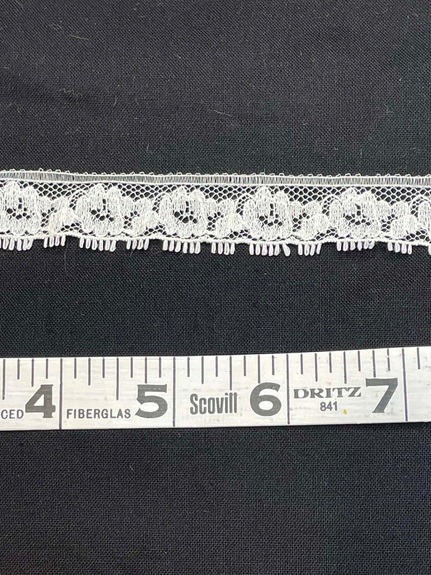 3/4" wide eyelash lace.  Sold by the yard.