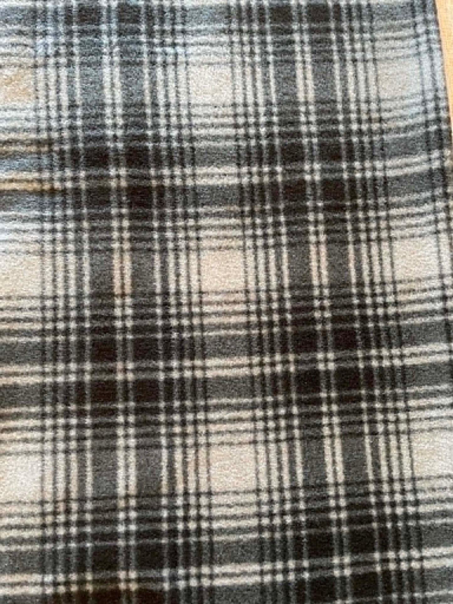 REMNANT ** Black and gray plaid fleece.